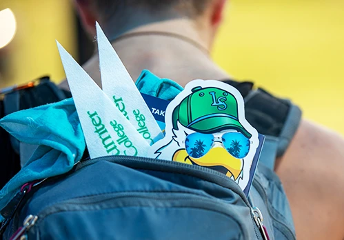 College logo and LSSC Swoop mascot on a blue backpack