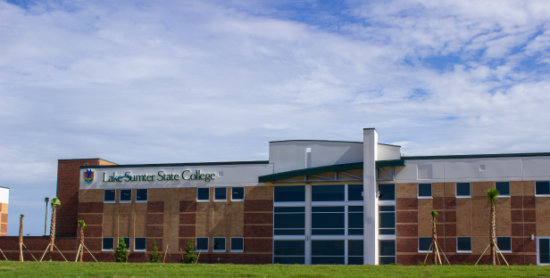 Two-story brick building exterior with Lake-Sumter State College sign.