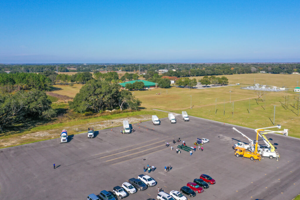 Aerial view of training site with trucks on paved lot