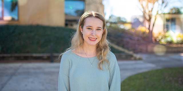 LSSC Honor's Student Shallan Burke poses in front of the Student Services Building on their Leesburg campus