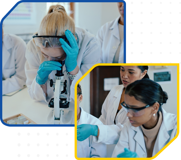 Individuals in lab coats and gloves discuss engineering experiment near microscope in laboratory setting.
