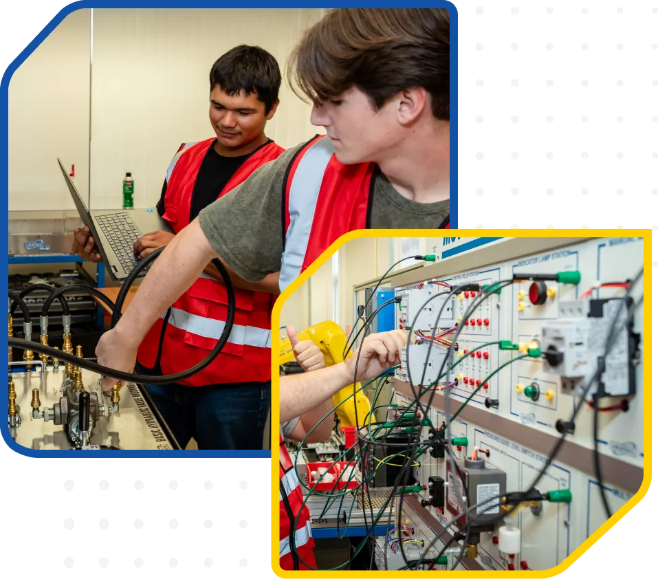 Two individuals in safety vests in an electrical engineering lab; one uses laptop, other adjusts wires on control panel.