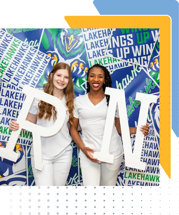 Lakehawks Nursing Grads stand smiling, holding white letters spelling "UP WIN" against a blue and white background with "LAKEHAWKS" printed throughout.