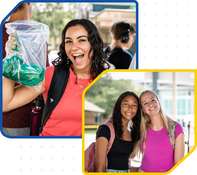 Two smiling young women walking together outdoors.