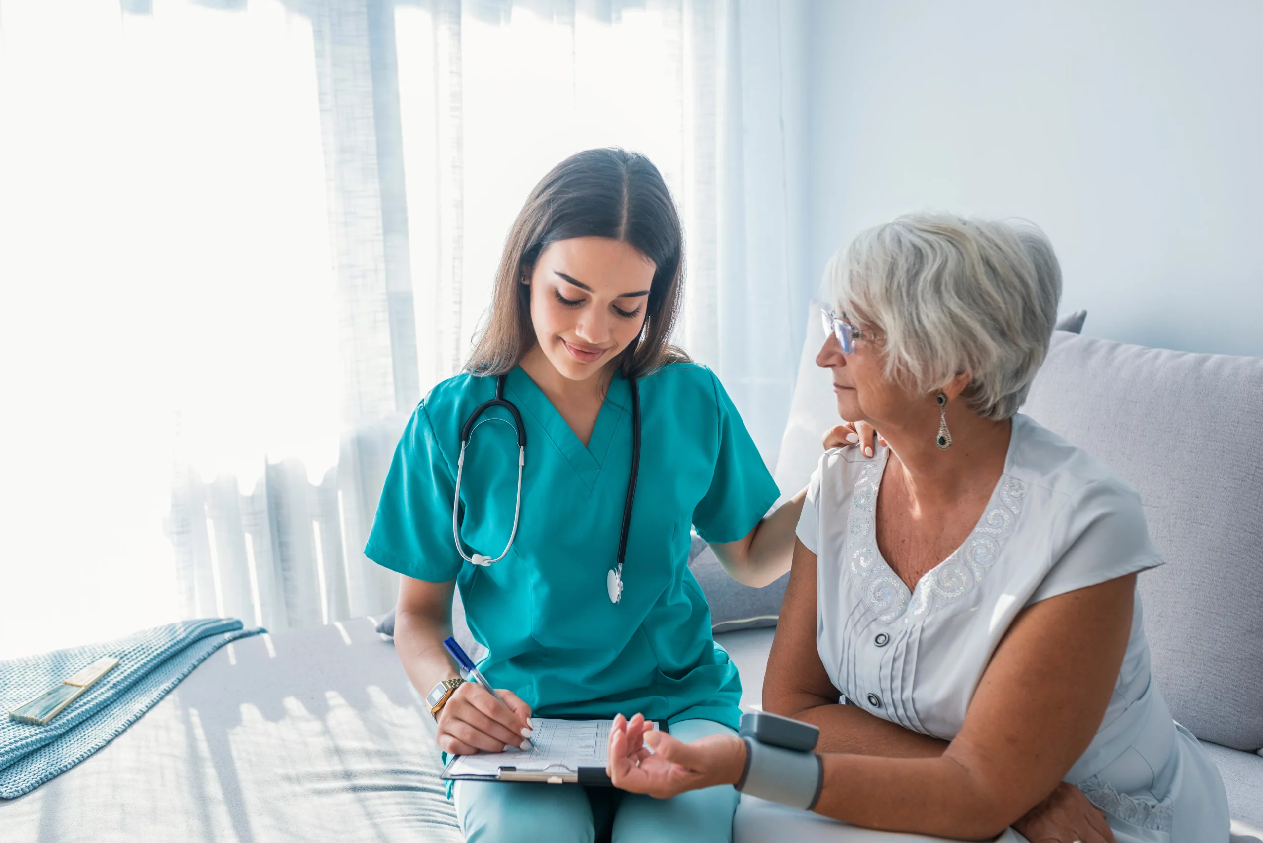 Nursing student consulting an elderly patient