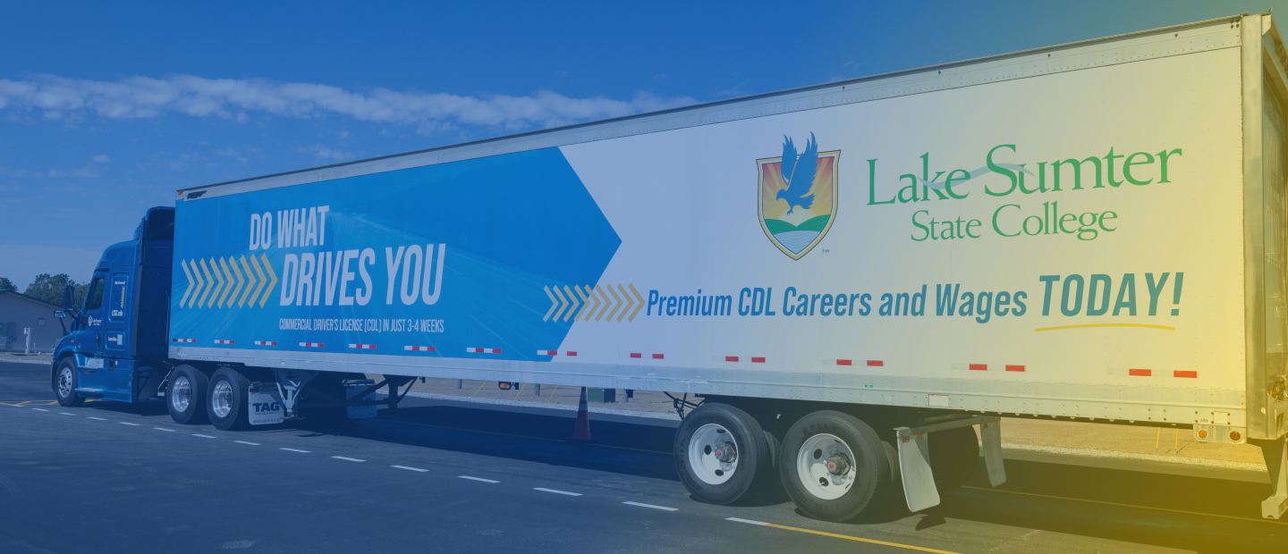 Lake-Sumter State College truck advertises CDL careers, wages, and the slogan "Do what drives you" on its side.
