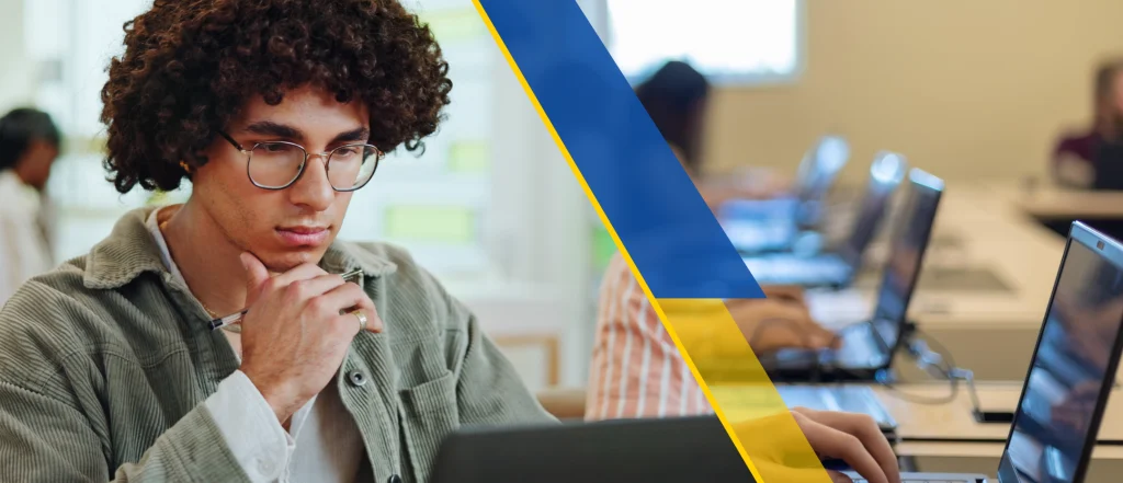 Student in library looking at laptop