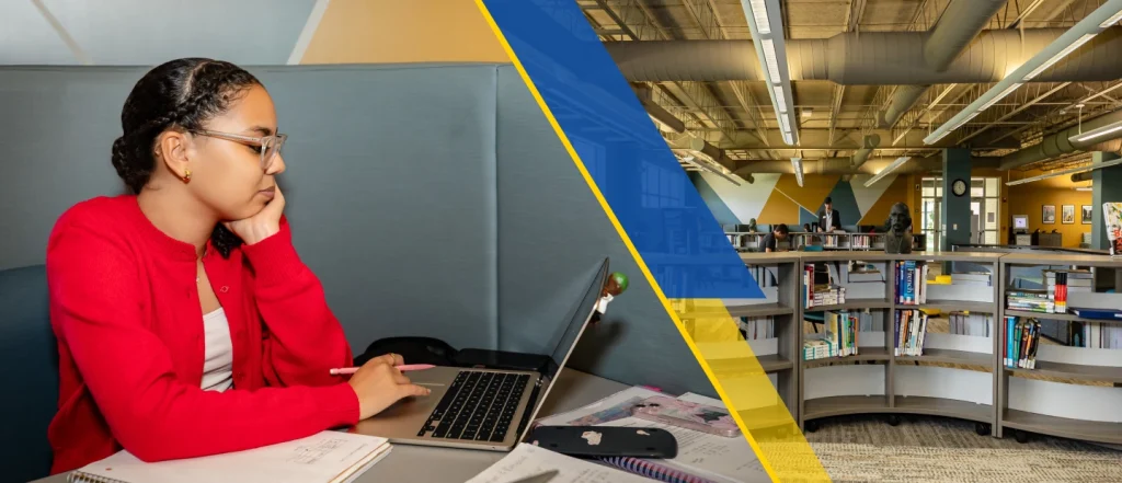 woman working on laptop at library table